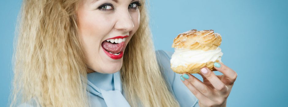 Woman Licking Lips As Shes About To Eat A Cream Cake