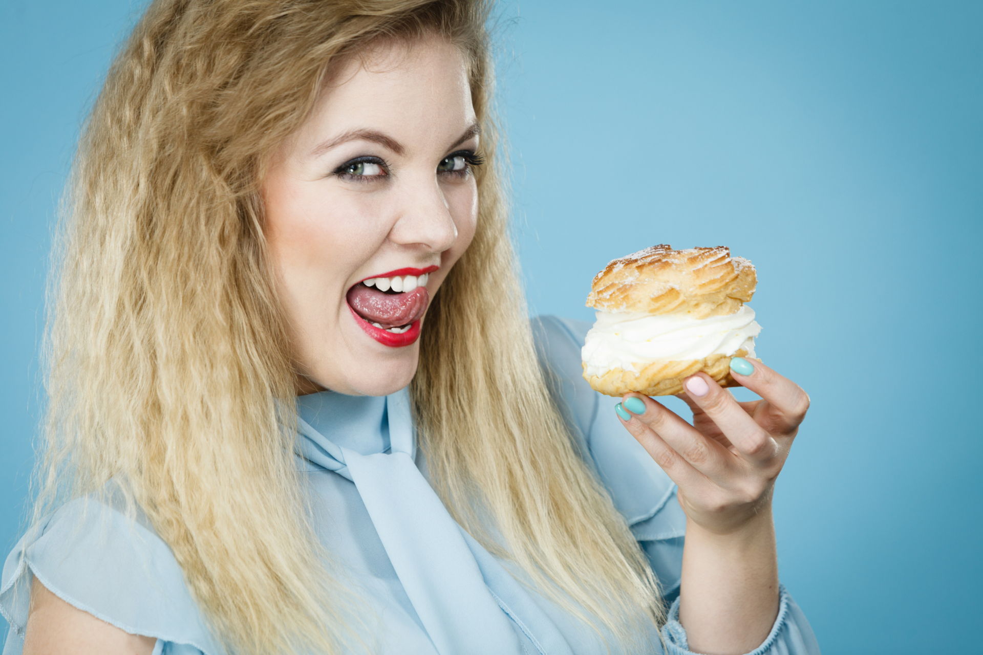 Woman Licking Lips As Shes About To Eat A Cream Cake