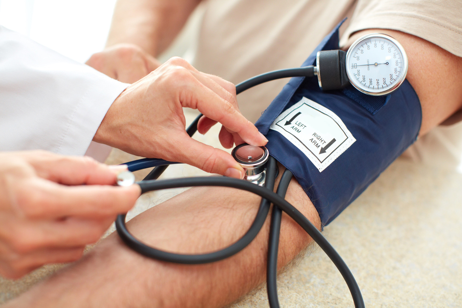 Doctor Taking A Patience Blood Pressure