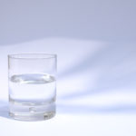 A Glass Of Water On A Light Background