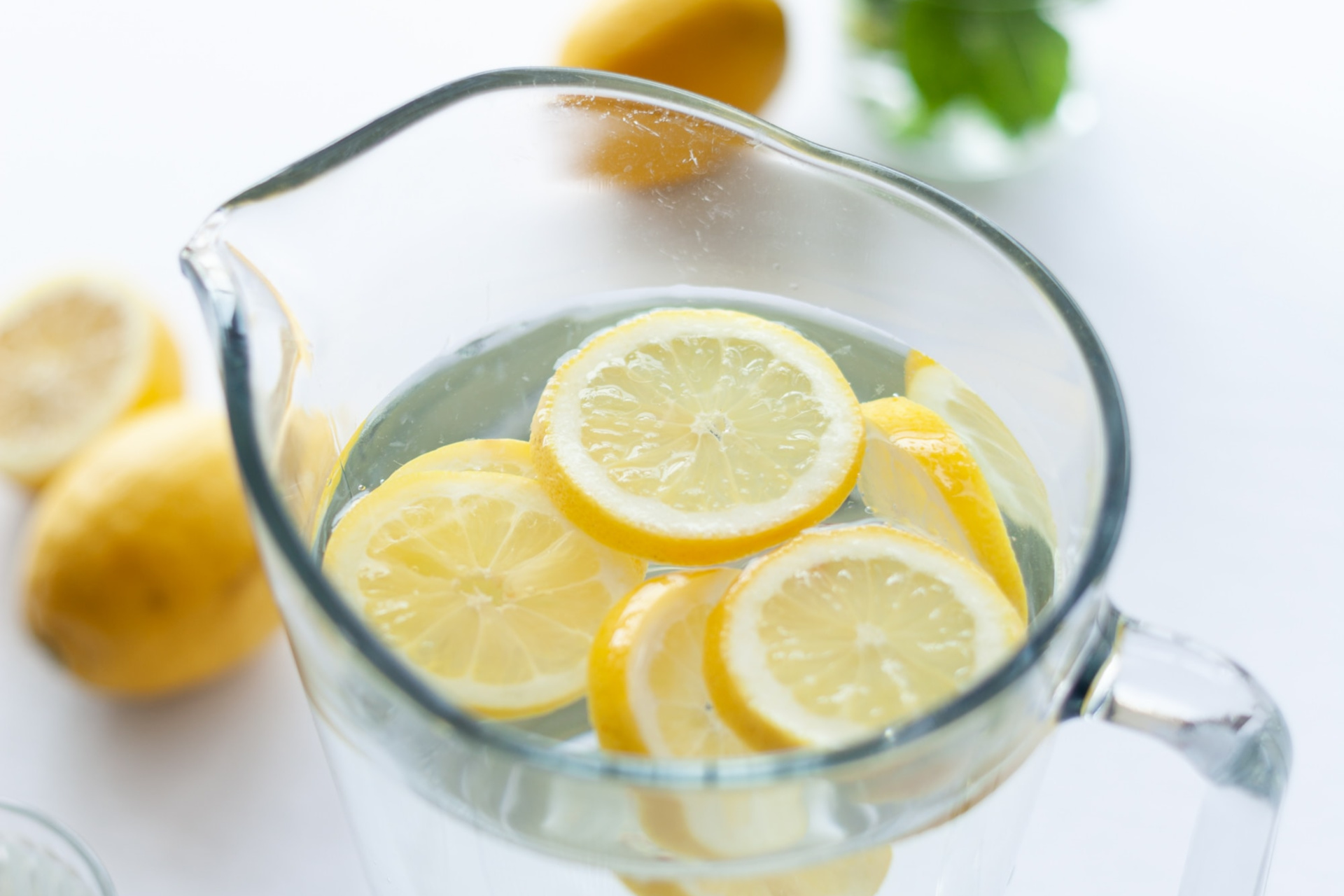 Jug Of Fresh Water With Some Lemon Slices