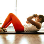 Woman Doing Situps On An Exercise Mat